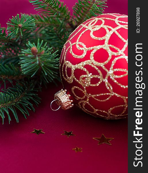 Christmas bauble on the red silk  background. Christmas bauble on the red silk  background