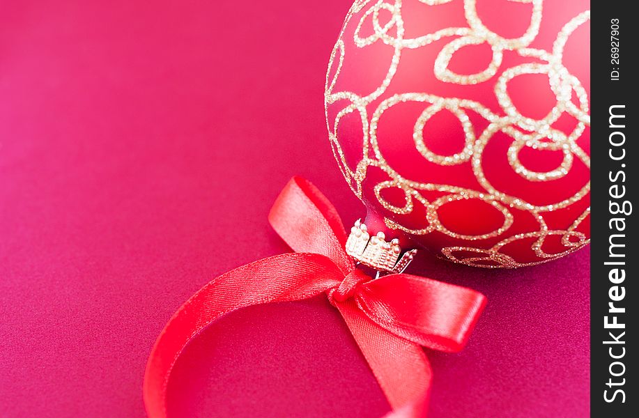 Christmas bauble on the red silk  background