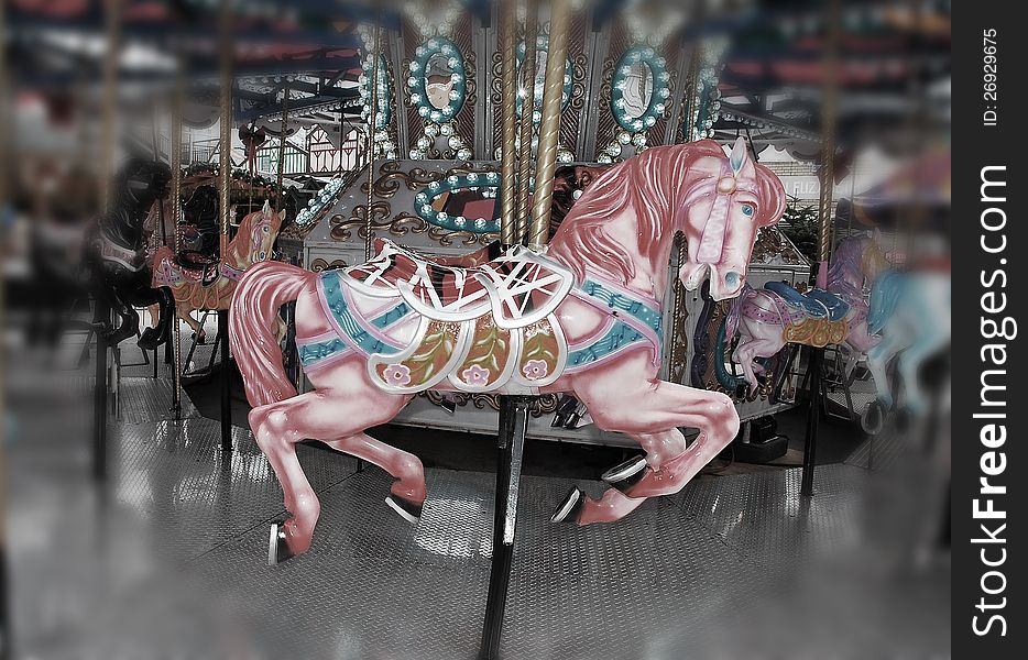 Pink carousel horse on merry go round at the fair