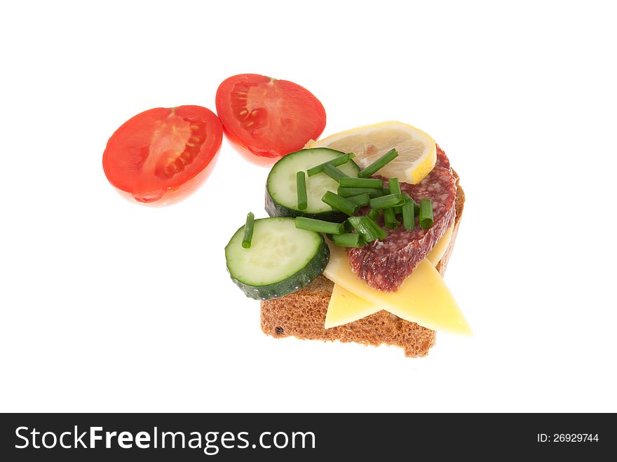 Bread with sausage, cheese and vegetables. Isolated on a white background. Bread with sausage, cheese and vegetables. Isolated on a white background.