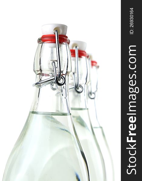 Water in three old-fashioned swing top bottles. Water in three old-fashioned swing top bottles