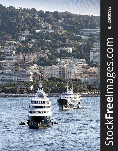 Group of luxury yachts anchored in Cannes coast, France.