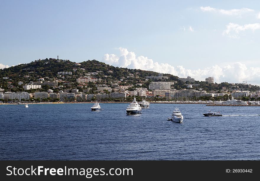 Group of luxury yachts anchored in Cannes coast, France.