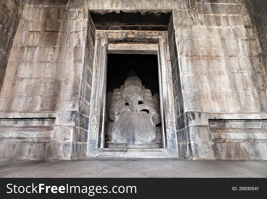 Indian god sculpture at Kadalekalu Ganesha Temple at the Sacred Center around Hampi, Karnataka, India