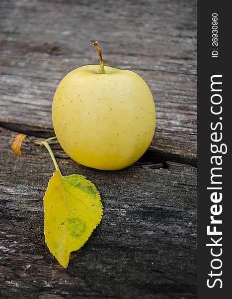 Homegrown apple on wooden background