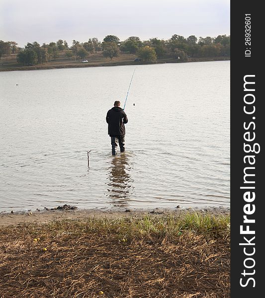 Fisherman Fishing in a lake