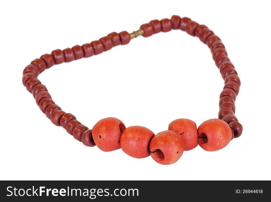 Ceramic beads and red, lying on a white background