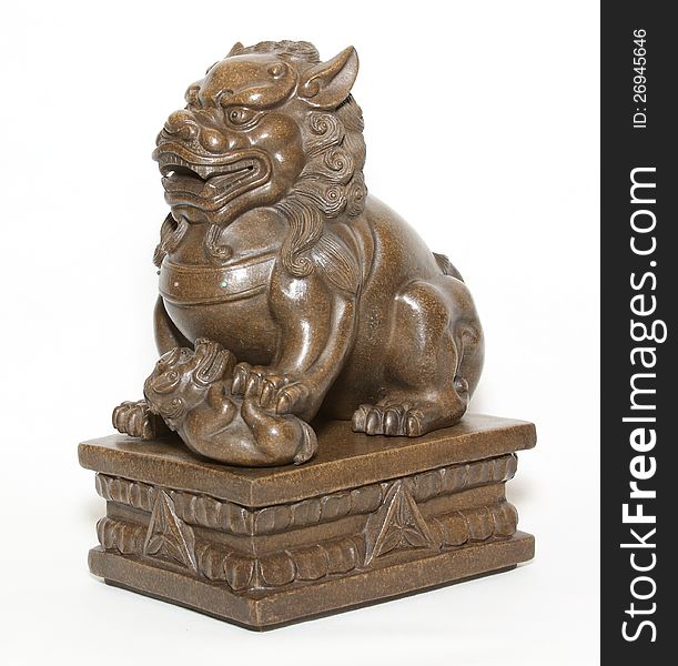 Sculpture of a seated lion. Sculpture of a seated lion