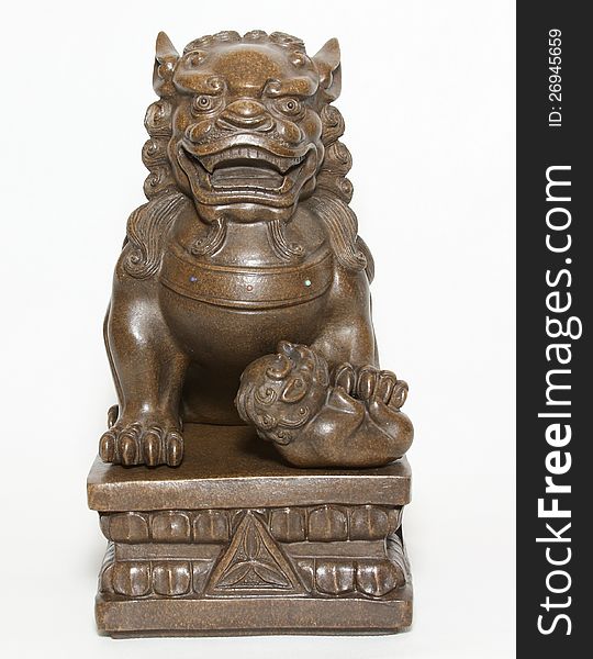 Sculpture of a seated lion. Sculpture of a seated lion