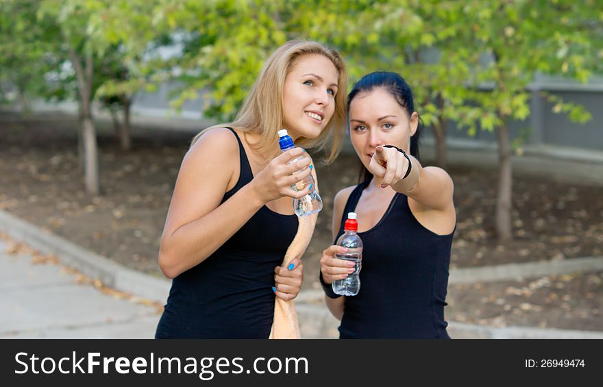 Woman Athlete Pointing Out Something