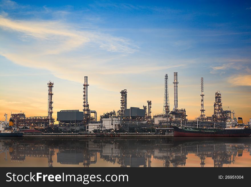 Refinery plant area at twilight with reflection