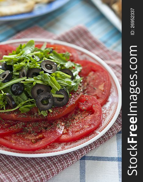 Tomato Salad With Olives And Arugula