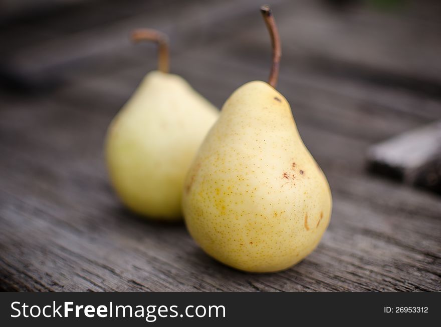 Homegrown pears on wooden background. Shallow depth of field.