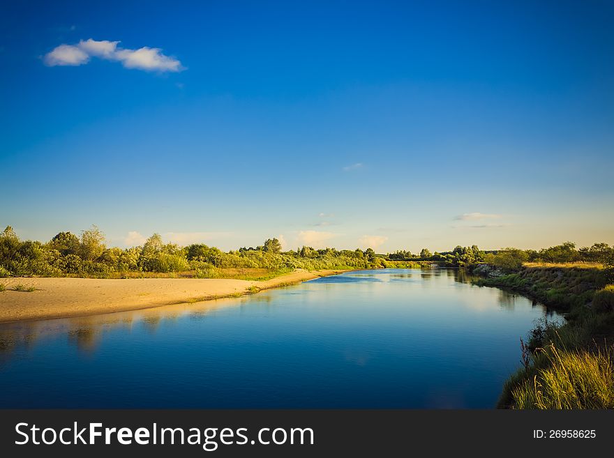 Wide panorama of a river and the forest