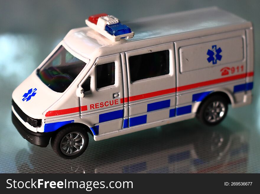 Hospital Rescue Ambulance Diecast Metal Car Model, blurred background.