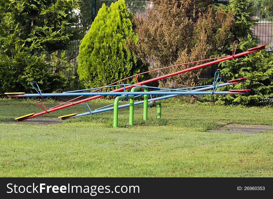 Seesaw on the childrens playground. Seesaw on the childrens playground.