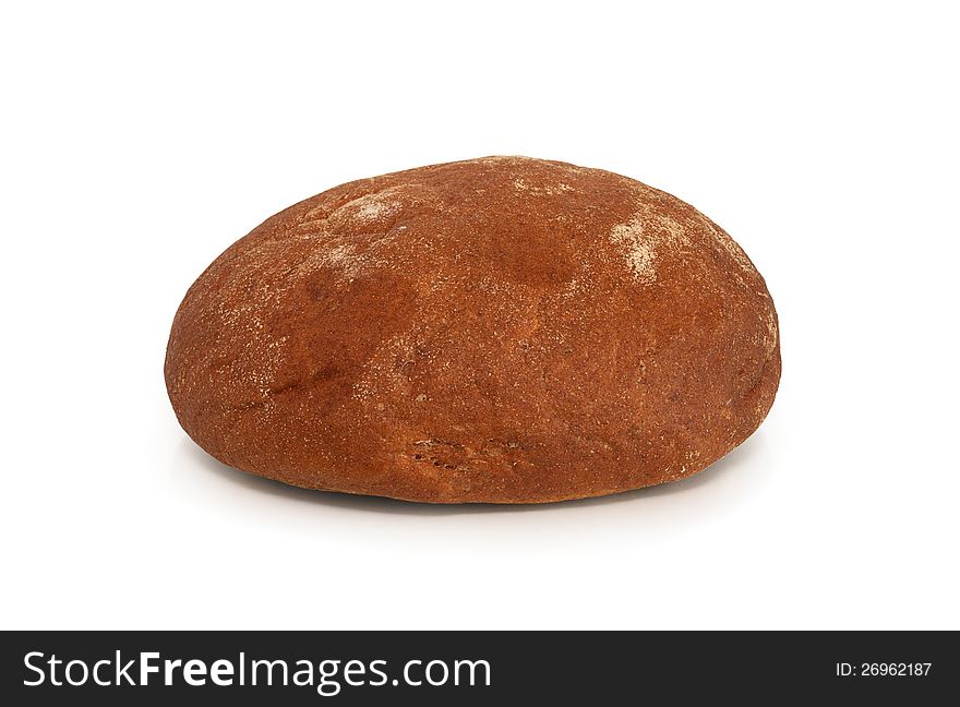 Round rye bread lying on white background. Clipping path is included