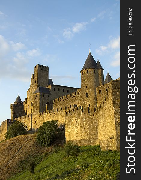 The beautiful fortified town on Carcassonne in Southern France pictured at dusk. The beautiful fortified town on Carcassonne in Southern France pictured at dusk