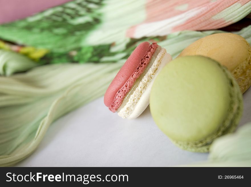 Close up pink macaron with colorful background