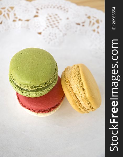 Three color french macarons dessert on table. Three color french macarons dessert on table