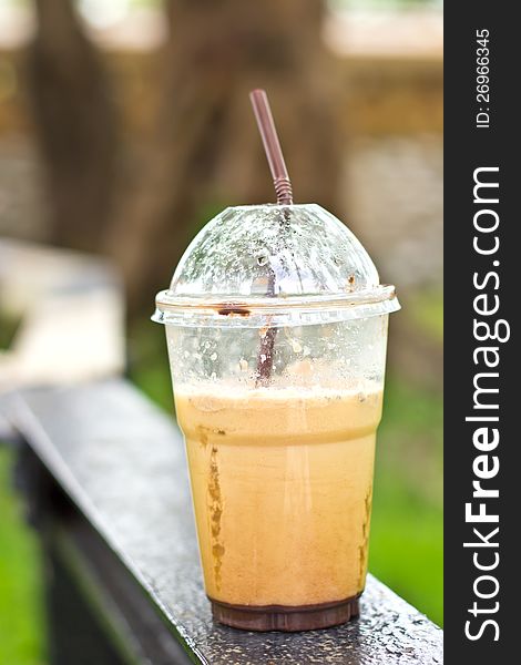 Delicious ice coffee cappuccino on wood table at outdoor. Delicious ice coffee cappuccino on wood table at outdoor