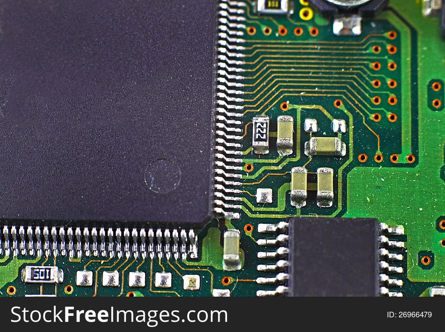 Digital hardware closeup. Microchips assembly on the circuit board macro