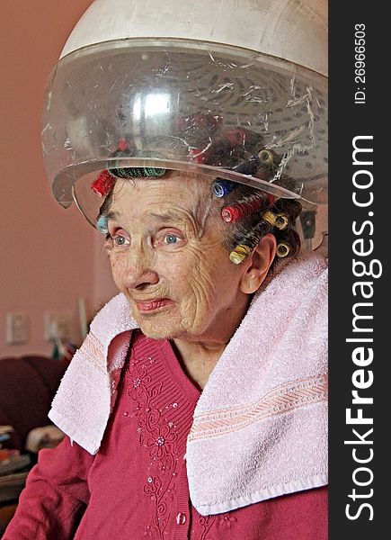 Photo of a female pensioner having her hair styled and under the dryer!. Photo of a female pensioner having her hair styled and under the dryer!