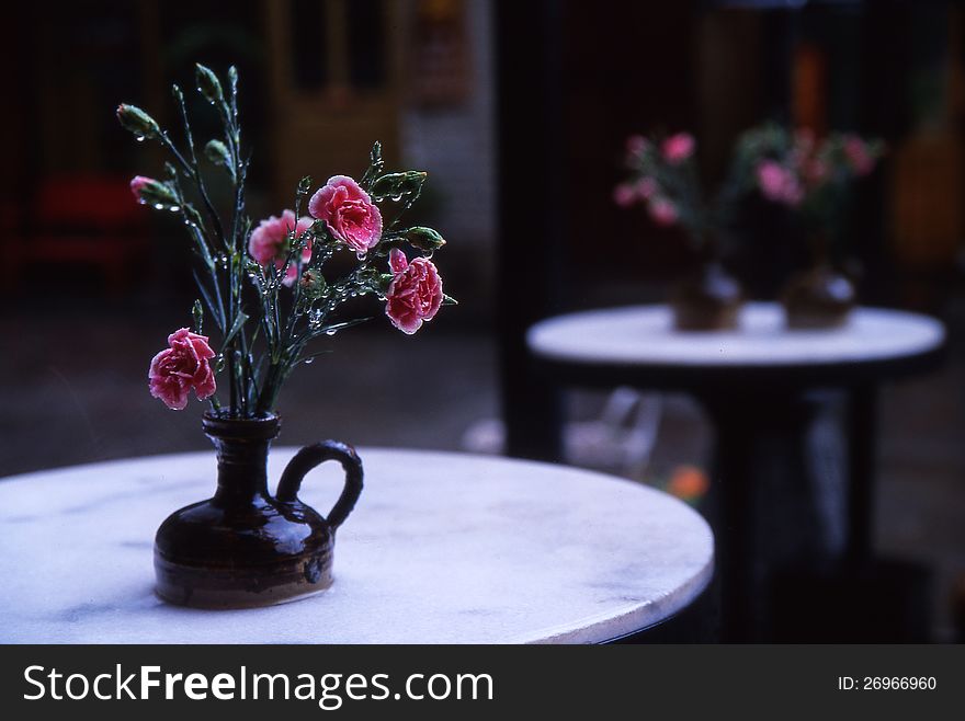 Flowers On Cafe Table