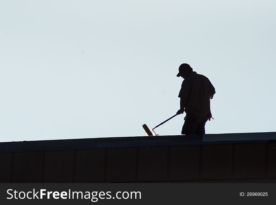 Silhouettes of one man at work. Silhouettes of one man at work.