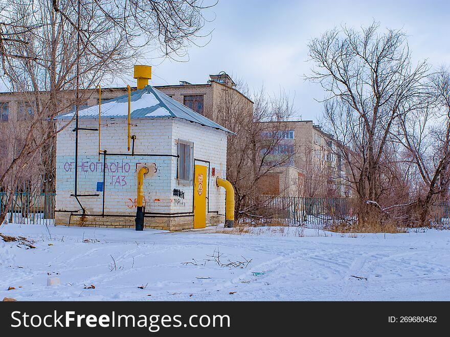 Bare Trees, Residential Buildings, Snow, The Gas Distribution Device Of Russian Gas In Action.