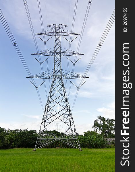 High voltage power pylons in the area of agricultural farms in Thailand, which can be dangerous. High voltage power pylons in the area of agricultural farms in Thailand, which can be dangerous.