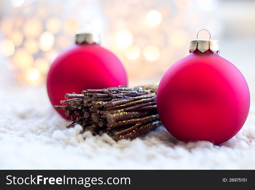 Closeup image of christmas decoration (christmas balls with branches) on white carpet