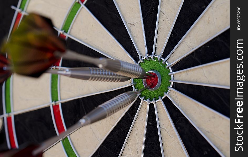 Darts in the red bullseye