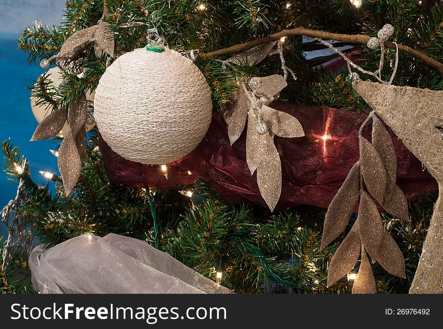 Christmas ball decoration with branch of Christmas tree