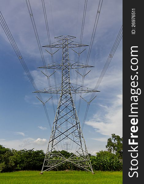 High voltage pylons on the paddy field, Thailand.