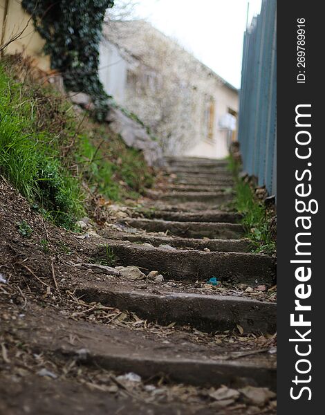 An Old Staircase On The Street. The Old District Of The City On A Hill. Dirty Stairs.