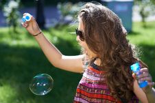 Young Girl Blows Soap Bubbles Stock Images Young Girl Blows Soap Bubbles Stock Images