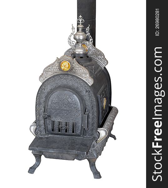 Vintage fancy cast iron wood burning heater stove with engraving and stainless steel decorations. Isolated on white. Vintage fancy cast iron wood burning heater stove with engraving and stainless steel decorations. Isolated on white.