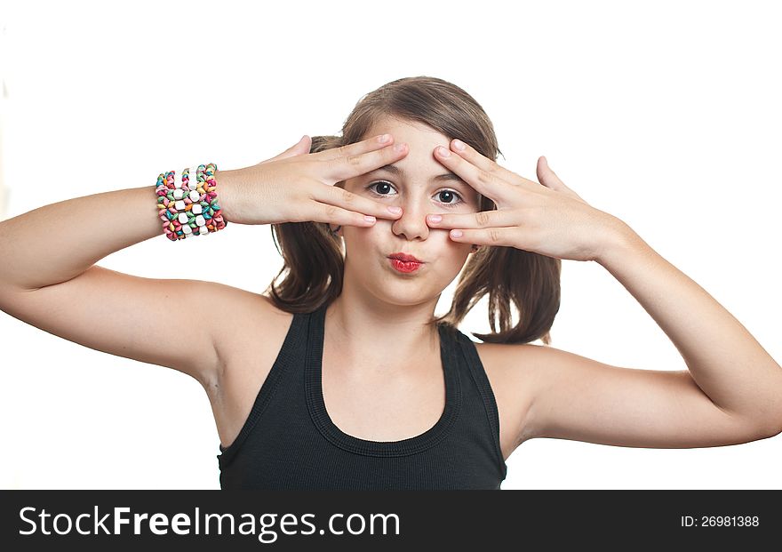 Girl covering eyes and peeping through her fingers