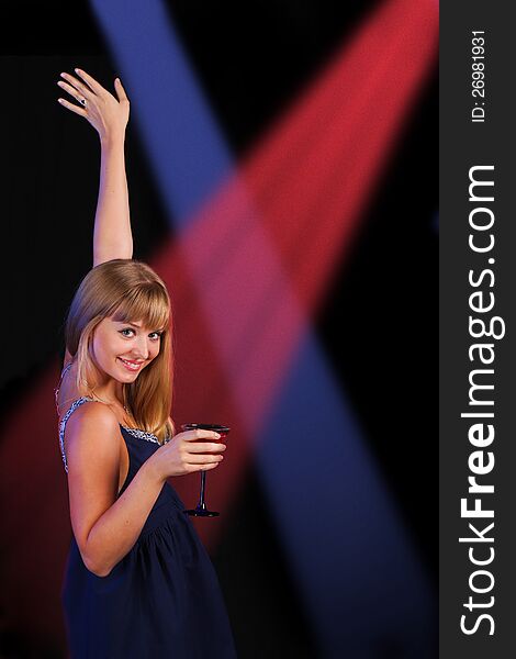 Girl with beverage on disco dancing