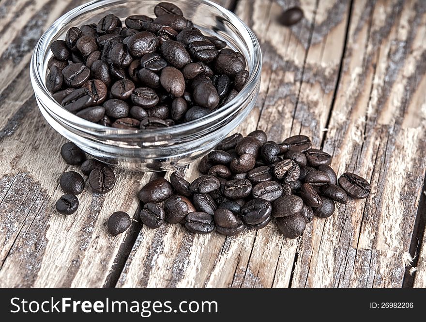 Coffee Beans On Old Wooden Table
