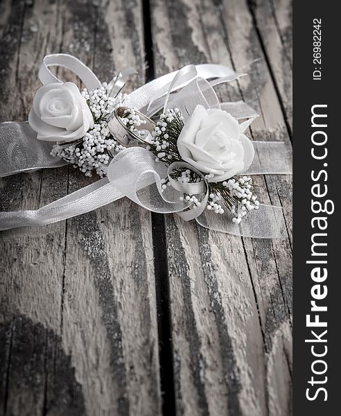 Wedding accessories on  old wooden plank