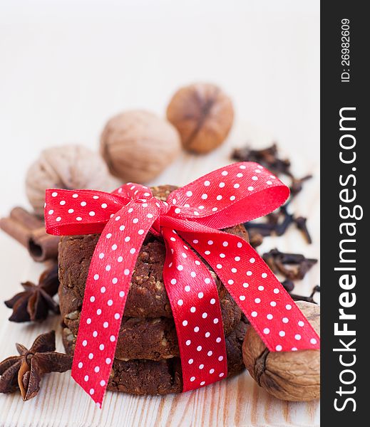 Still life with delicious Christmas cookies with red ribbon