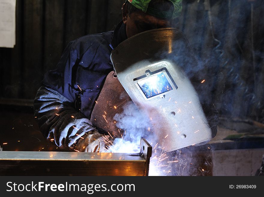 Man at work with welding tool. Man at work with welding tool