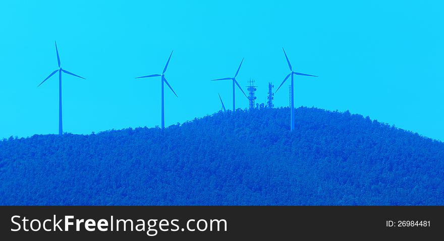 A picture of wind turbines on a mountain. A picture of wind turbines on a mountain