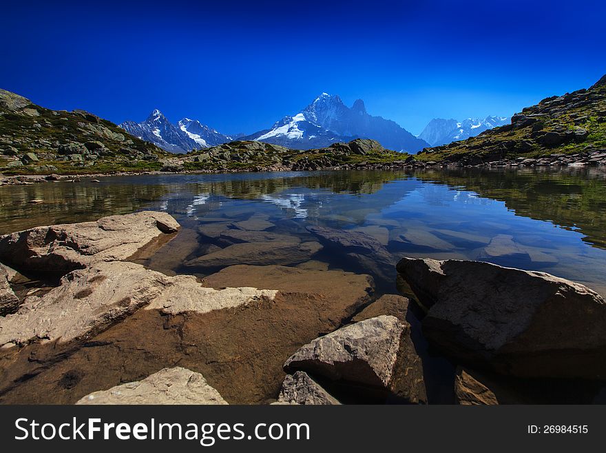 Alpine Lake Reflection In The French Alps