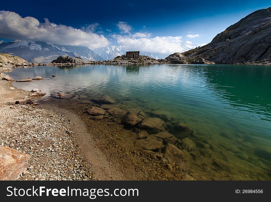 Alpine lake reflection in the French Alps in the Mont Blanc Massif