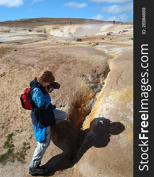 The female photographer photographing outdoors