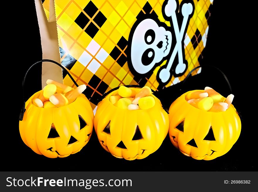 Jack o lanterns filled with candy corn for trick or treat. Jack o lanterns filled with candy corn for trick or treat