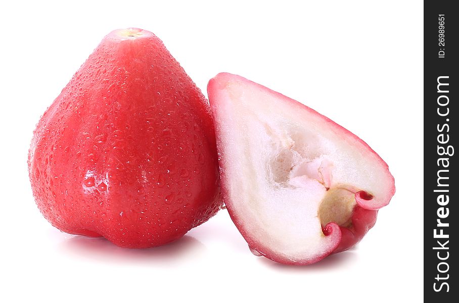 Rose apple sliced into half isolated on white background